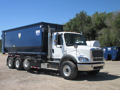 Photo of a roll-off truck.